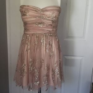 tulle mini dress with gold print details.